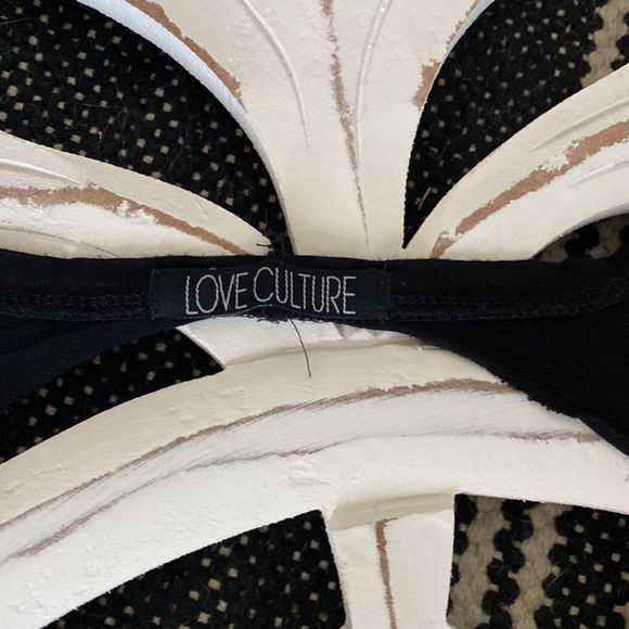 Black tank top with open back and skull design. Size medium. - Picture 3 of 5